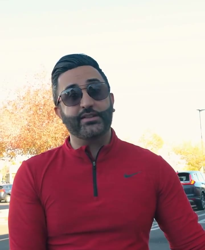Roni Warda in a red quarter-zip, from the video where he explains the CARE logo