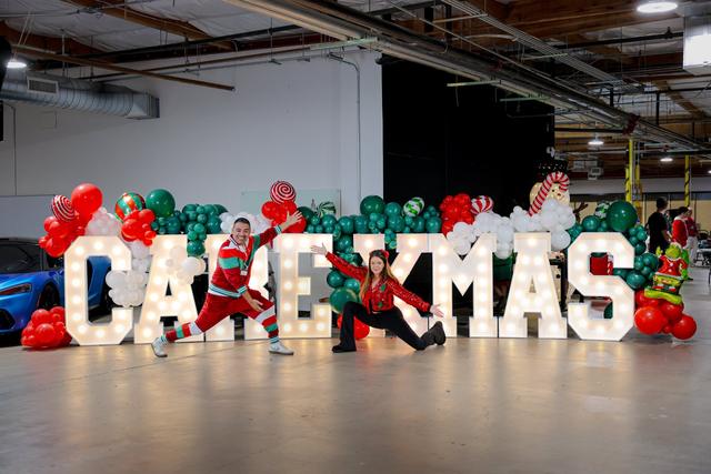 Giant light-up CARE XMAS letters at Claus for a Cause