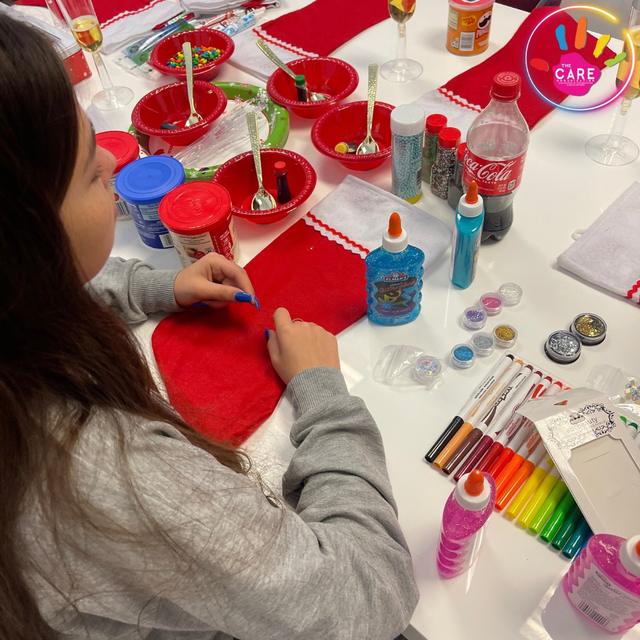 A child doing arts and crafts at a CARE table