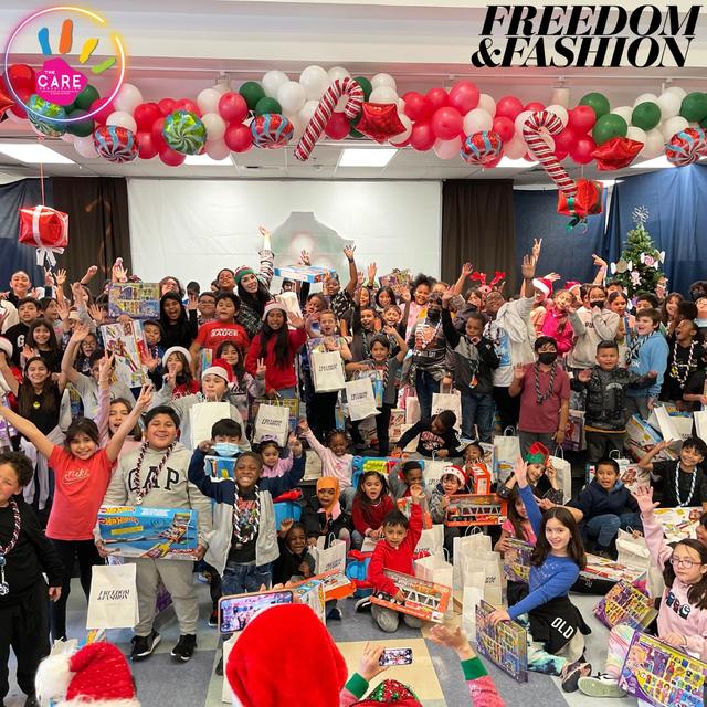 A big group of kids holding up their new toys