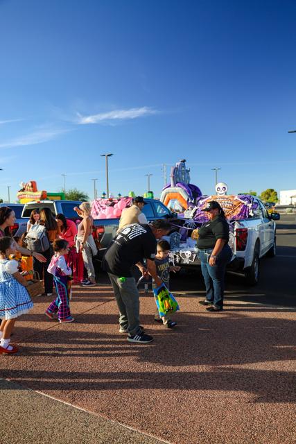Families in costumes at Trunk or Treat